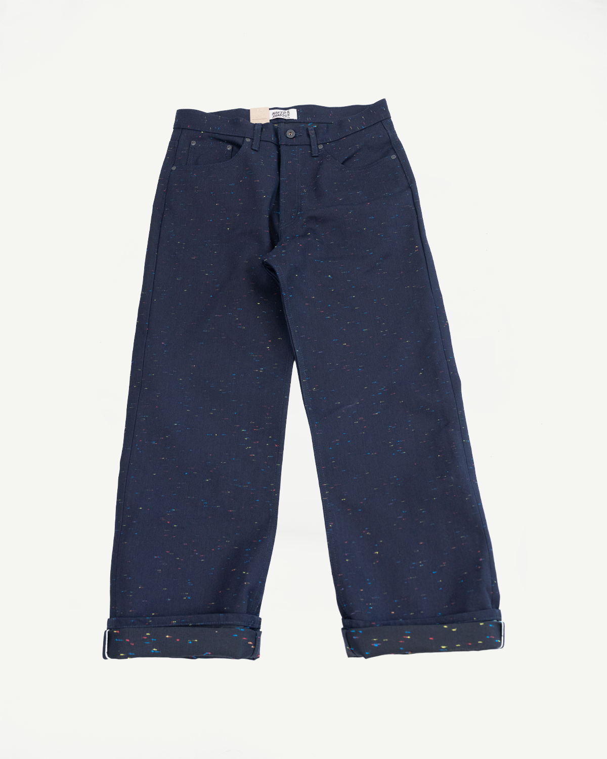 Front view flat lay of navy blue speckled pants with cuffed hems.