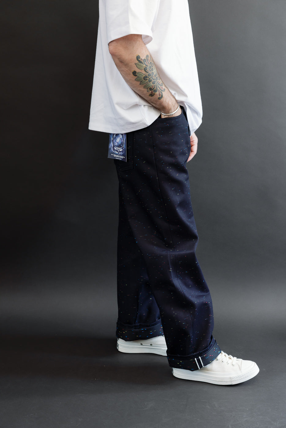 Full body side view of a male model, 5'9