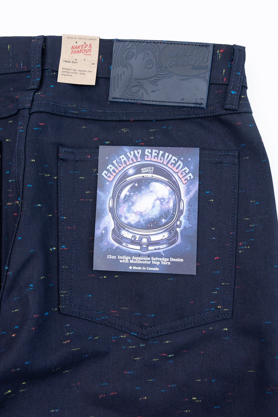 Close-up of the back of Naked & Famous Galaxy Selvedge denim jeans showing the pocket patch and tag.