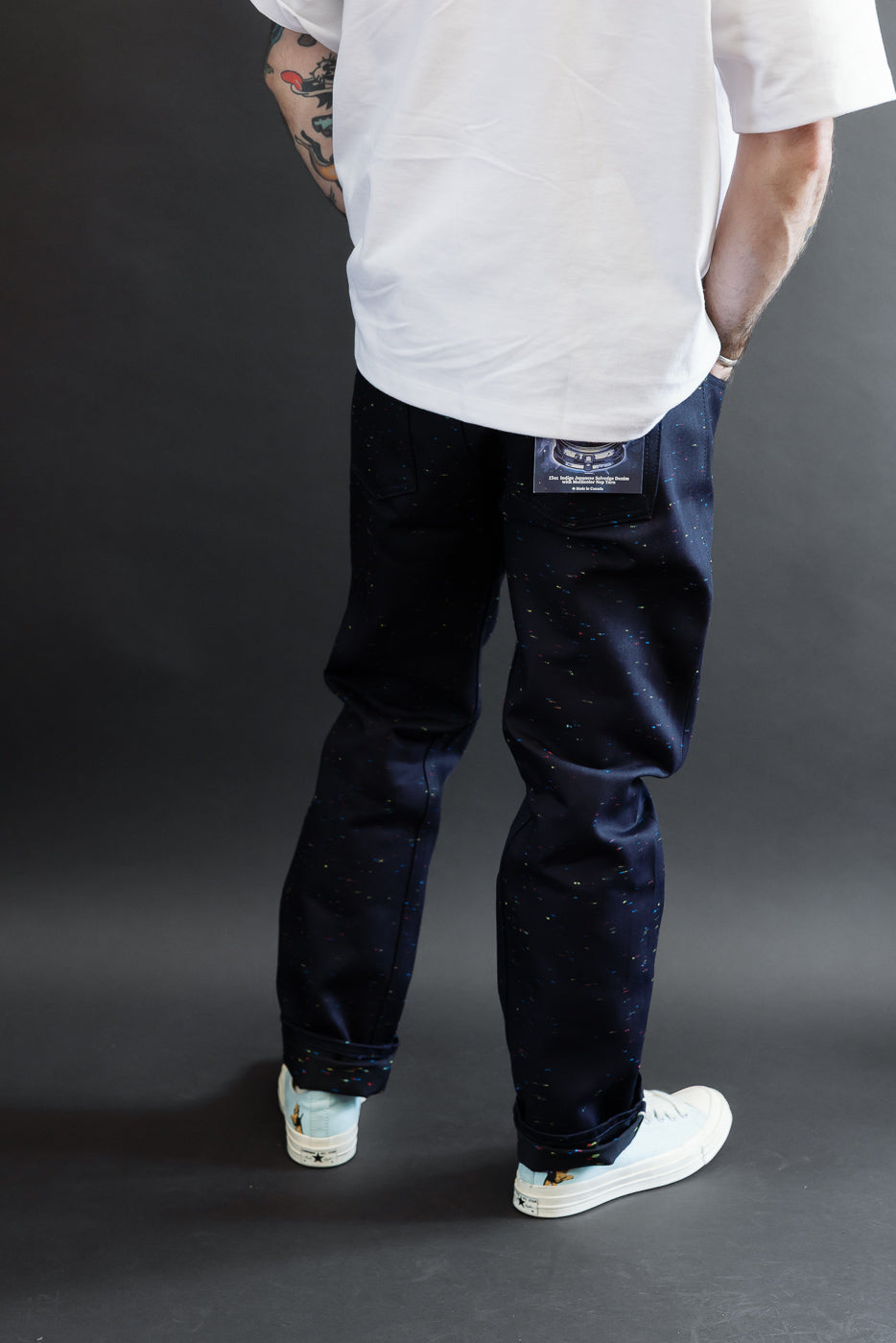 Back view of navy speckled pants on a male model, 5'9