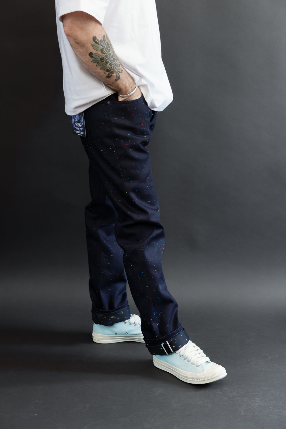 Full body side view of a male model, 5'9