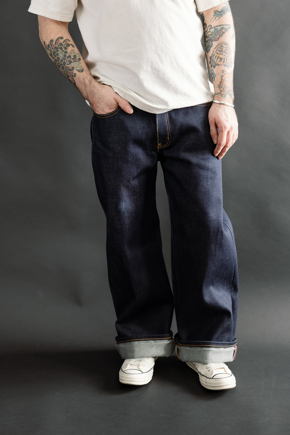Front view, cropped full body of male model 5'9