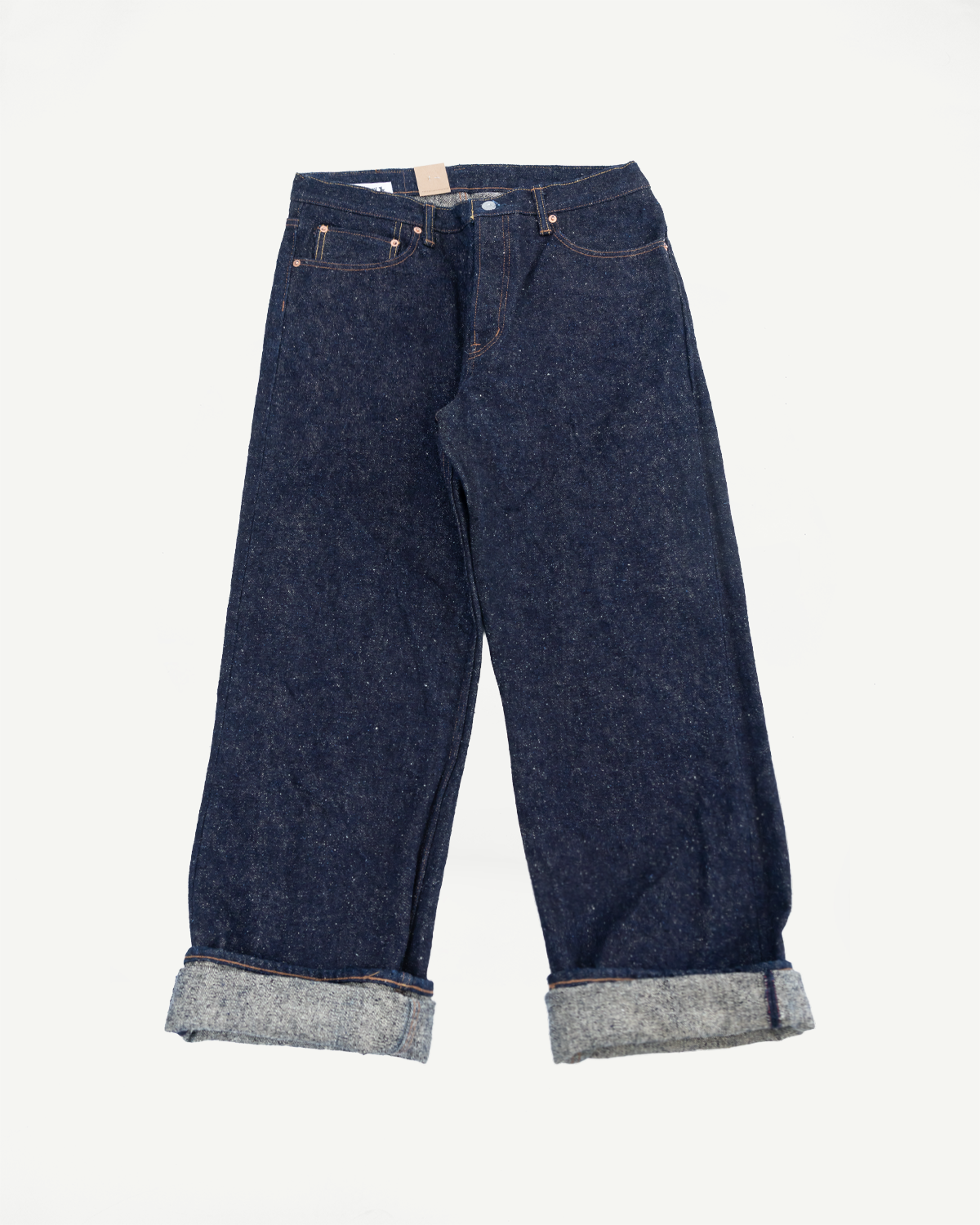 Front view flat lay of Naked & Famous Genseki Selvedge jeans, dark wash, cuffed hem, classic denim details.