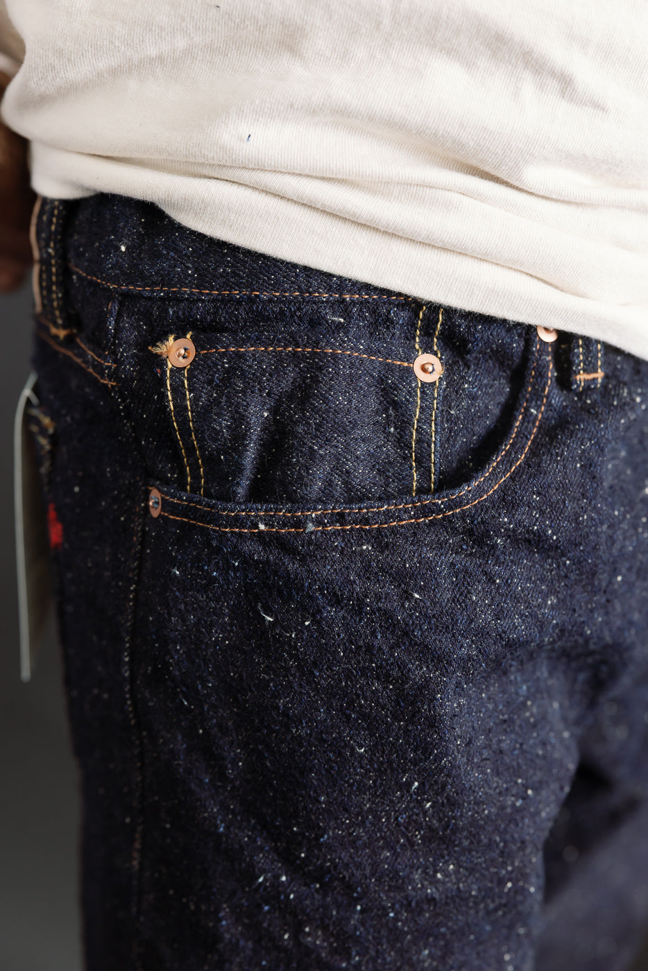 Close-up of Naked & Famous Genseki selvedge denim front pocket, male model 5'9