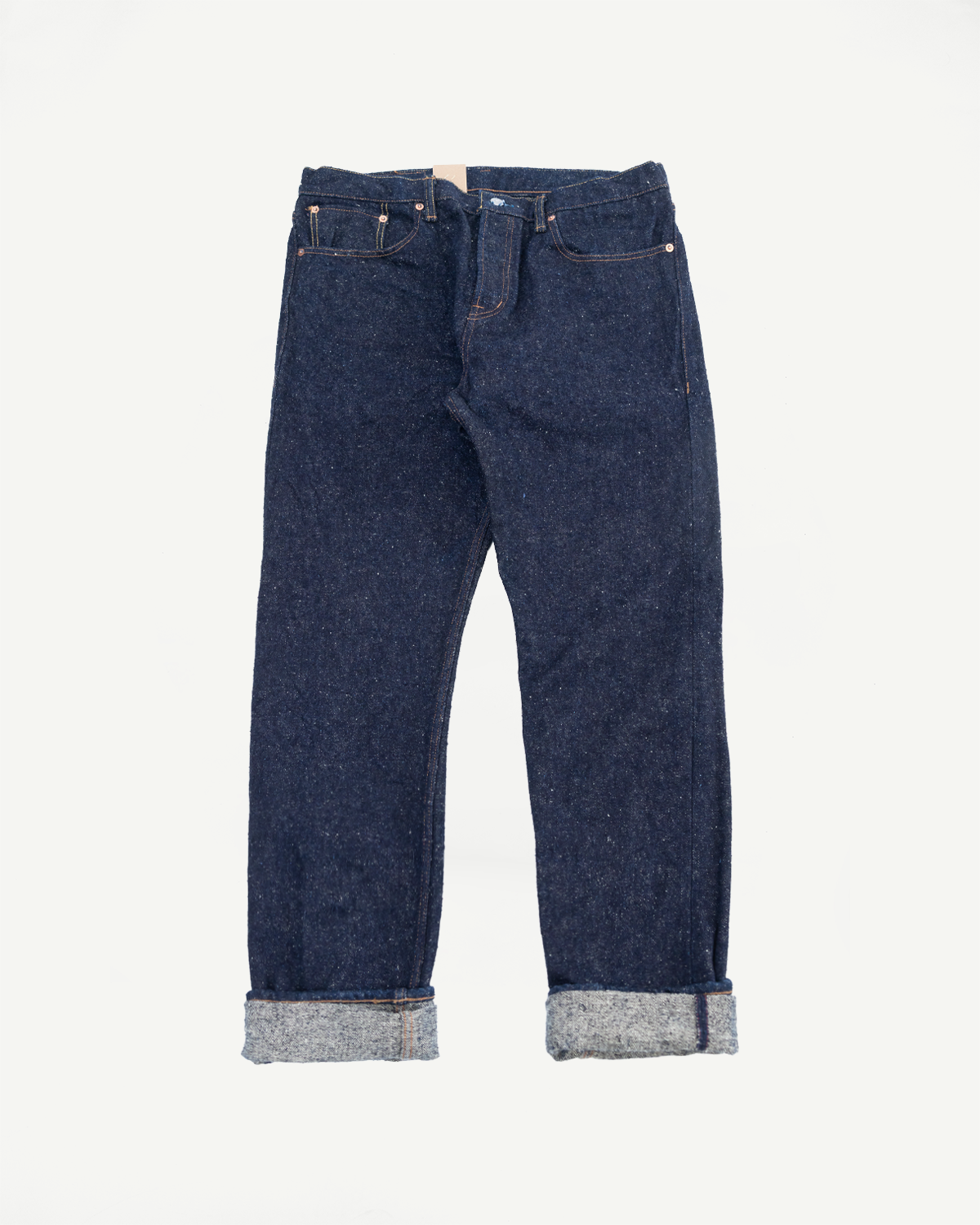 Flat lay front view of Naked & Famous selvedge denim jeans, cuffed hems, indigo texture, Dant
