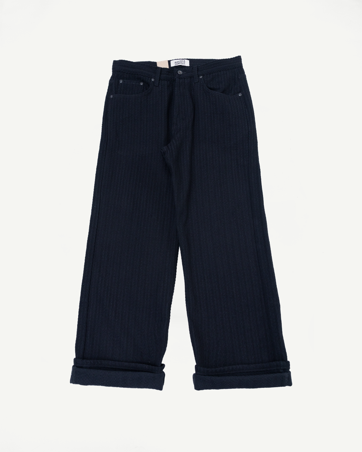 Front view flat lay of navy blue wide-leg corduroy trousers with cuffed hems.