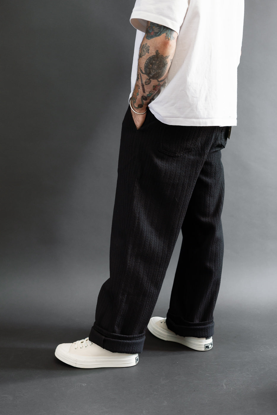 Full body side view of a male model, 5'9