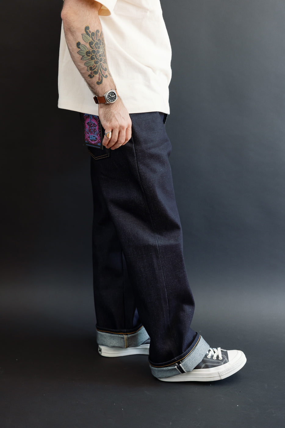 Full body side view of a male model, 5'9