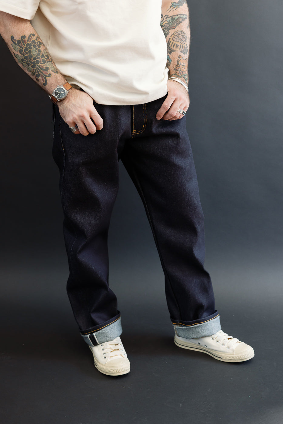 Front view of raw selvedge denim jeans on a male model, 5'9