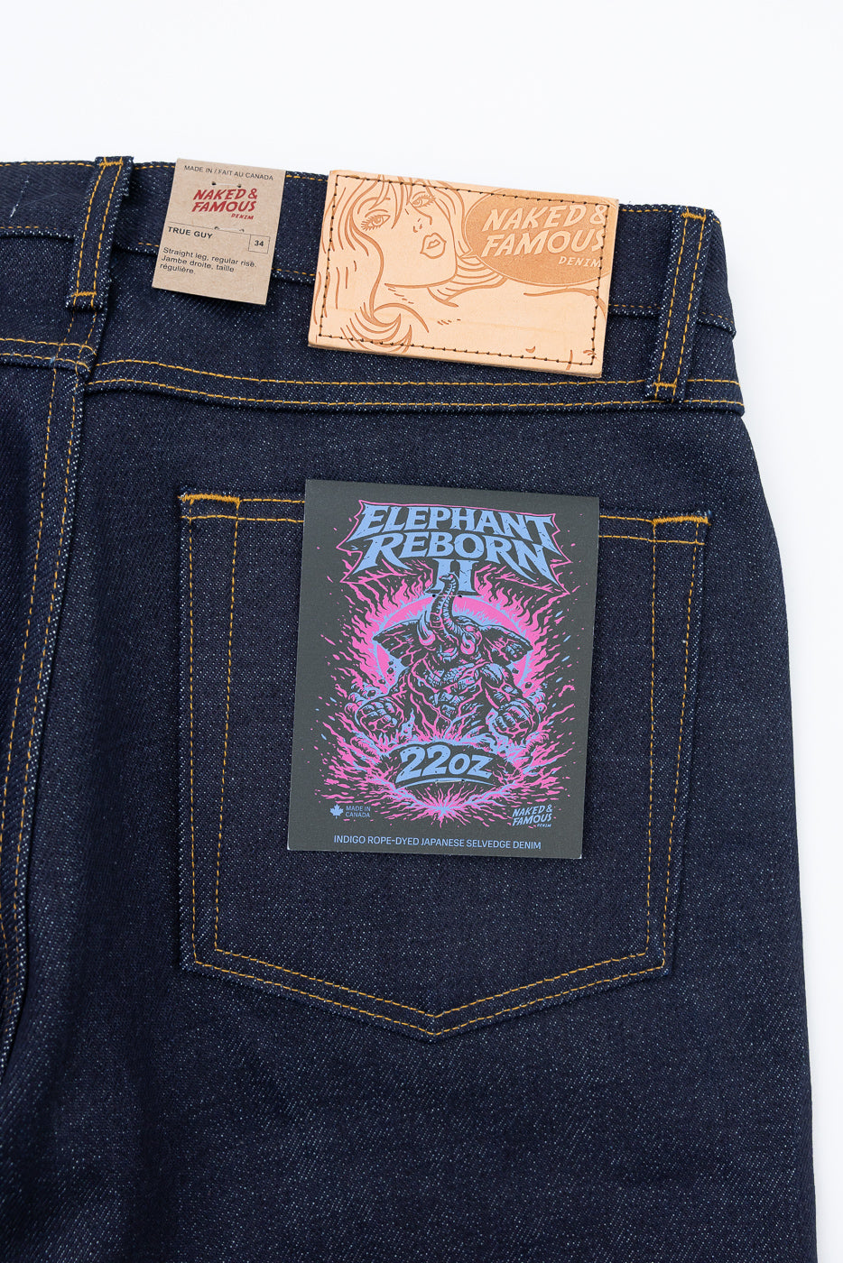 Close-up of the back of Naked & Famous 22oz denim jeans showing a leather patch and tag.