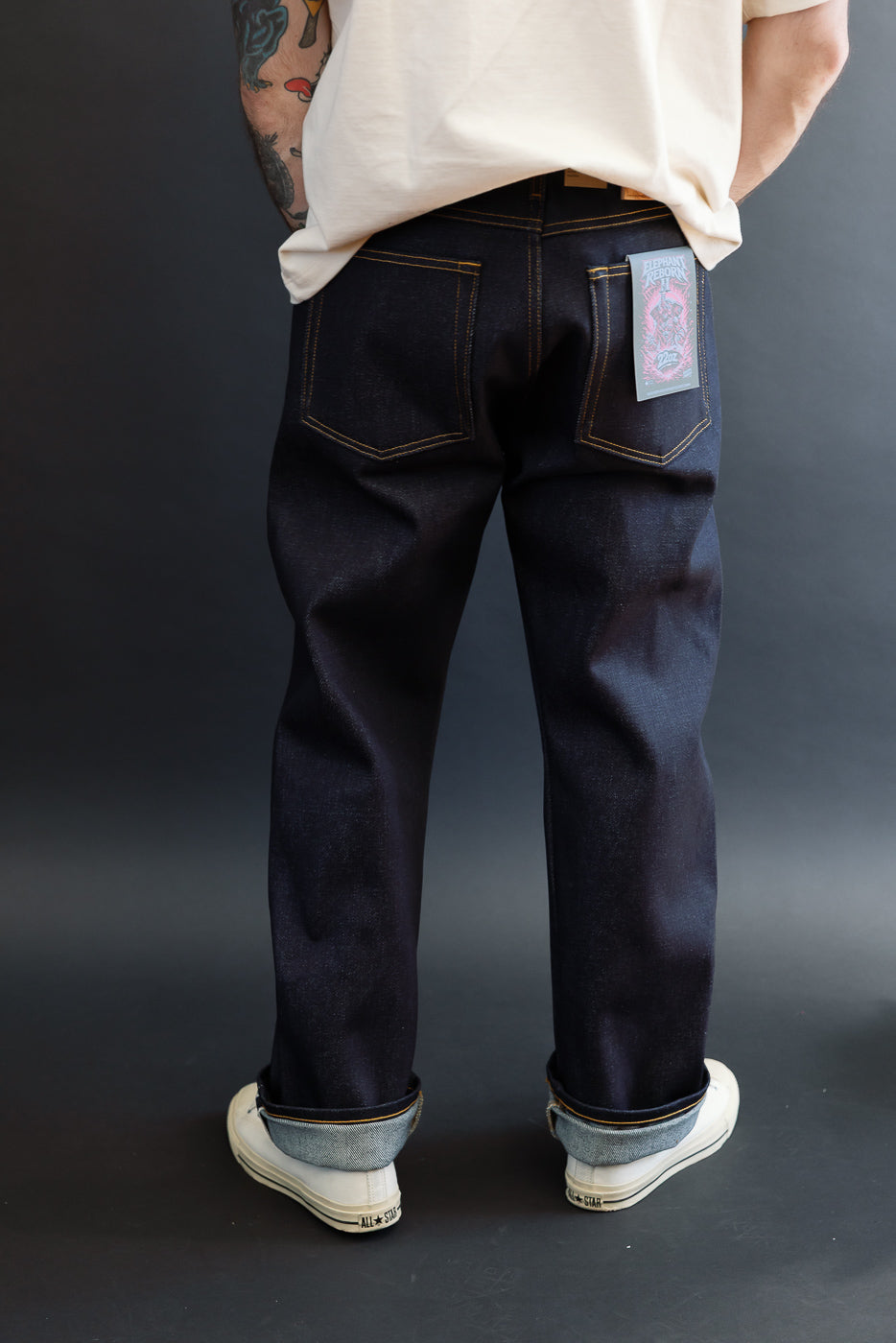 Back view of selvedge jeans on male model (5'9