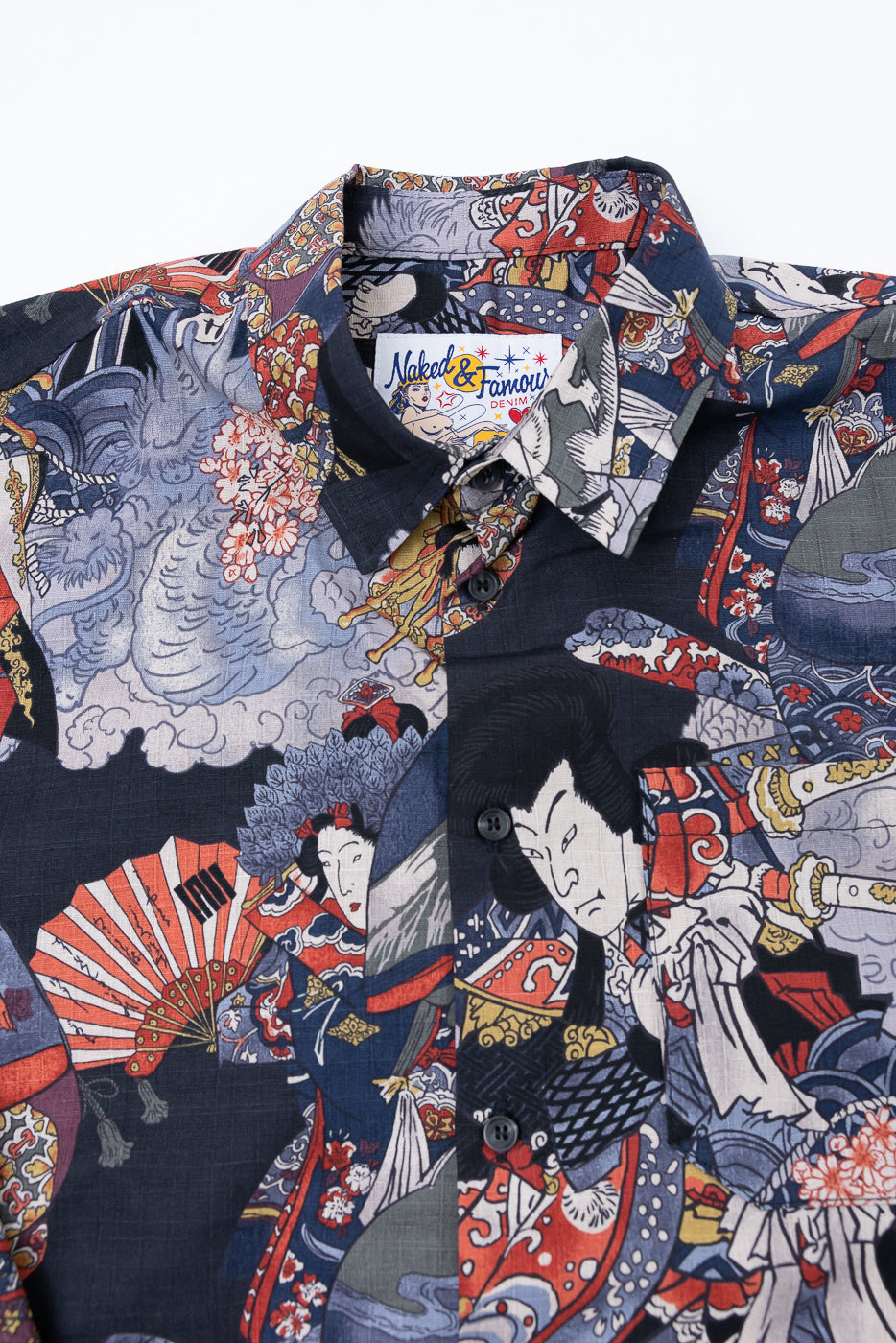 Close-up front view of a navy button-down shirt featuring a detailed Japanese ukiyo-e print.