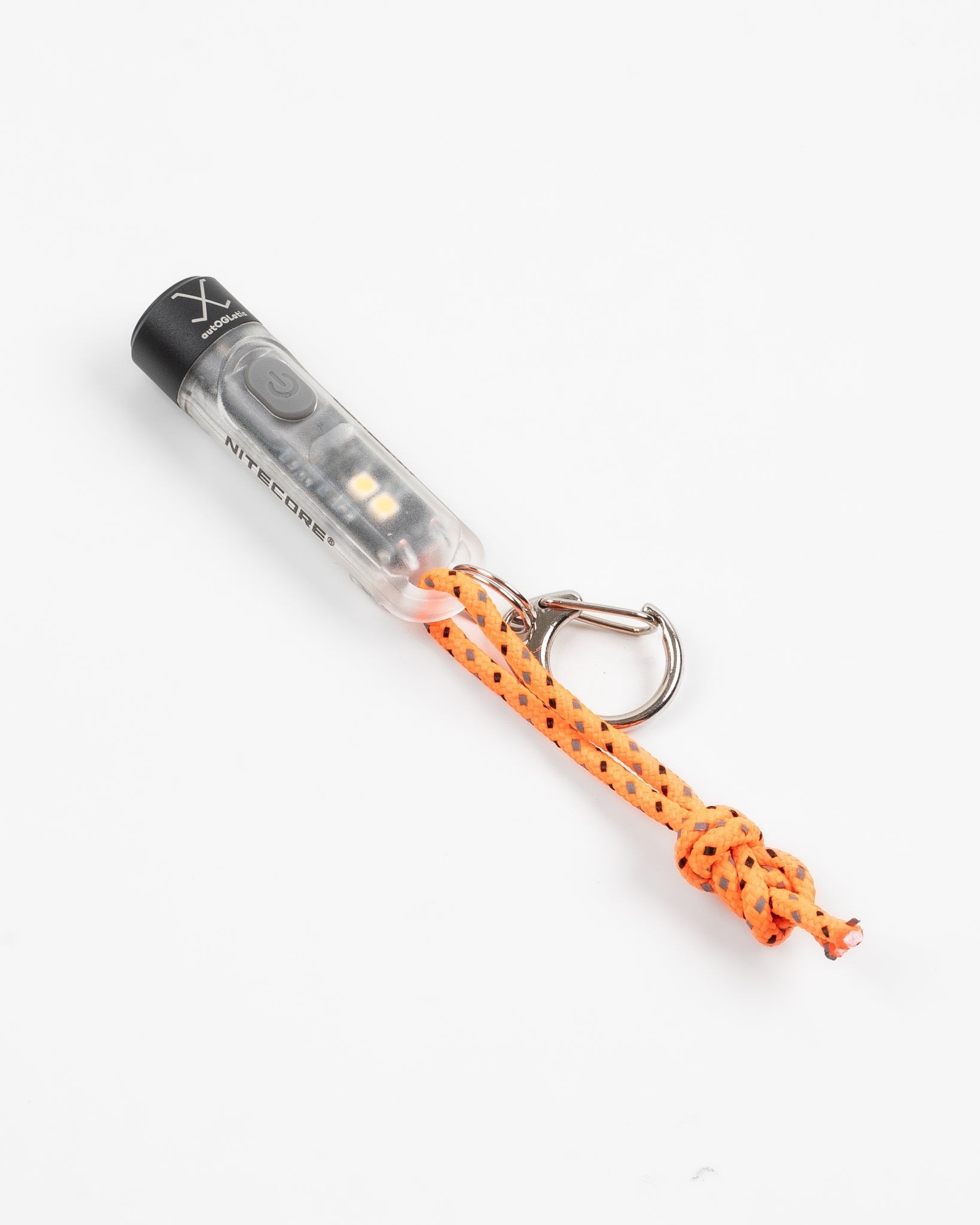 Close-up of compact LED keychain flashlight with orange cord and metal keyring, front view.