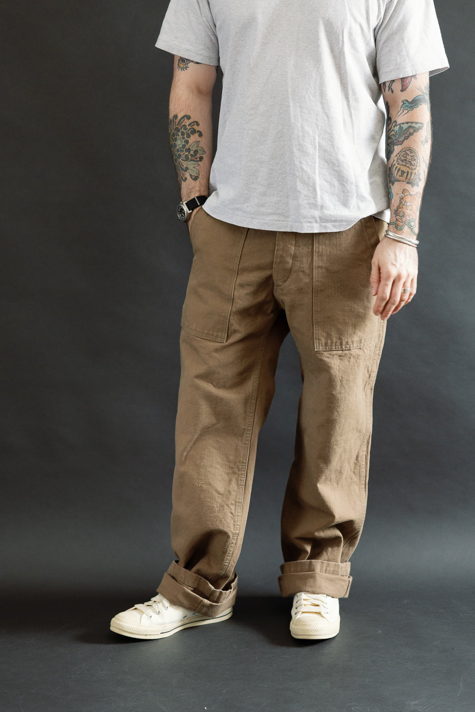 207-HOX-BRK Brown Khaki Sulfur Dyed Heavy Oxford Baker Pants feature a wide straight cut and high-rise fit, shown with rolled cuffs and patch pockets, embodying Dant's premium Japanese workwear aesthetic.