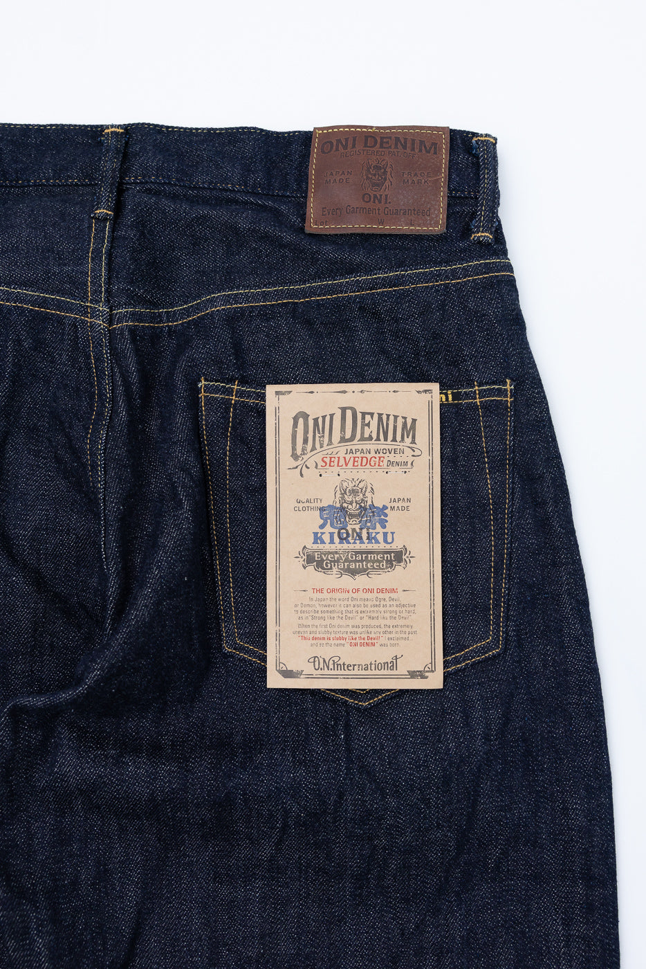 Close-up of Oni Denim selvedge jeans back, showcasing leather patch and pocket label details.