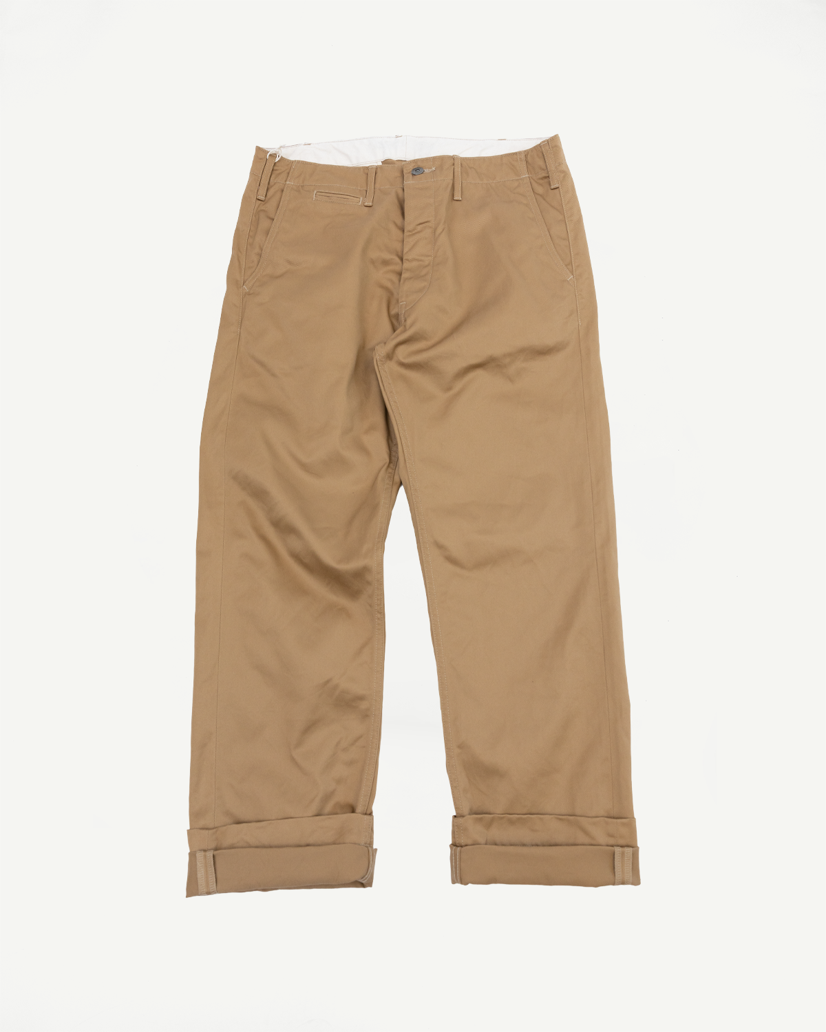 Tan work pants flat lay front view, cuffed hems, button fly, front pockets, durable fabric