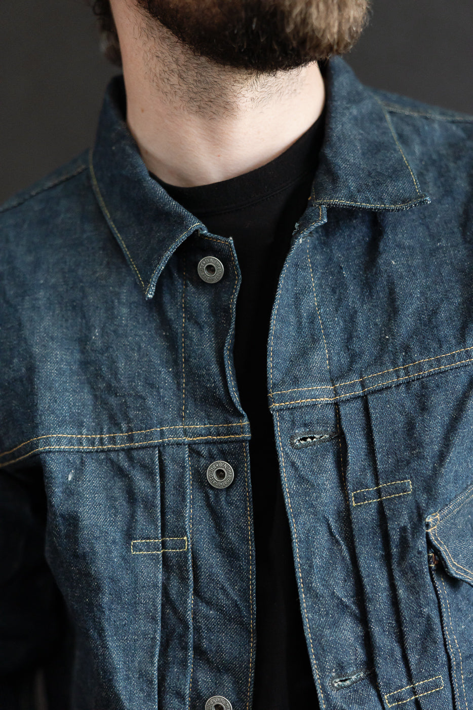 Close-up front of 15oz selvedge denim jacket on male model 5'9