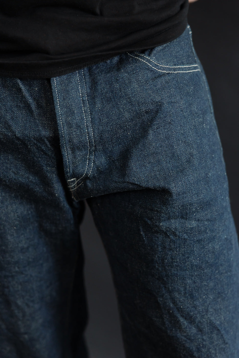 Close-up front view of men's selvedge denim jeans on 5'9