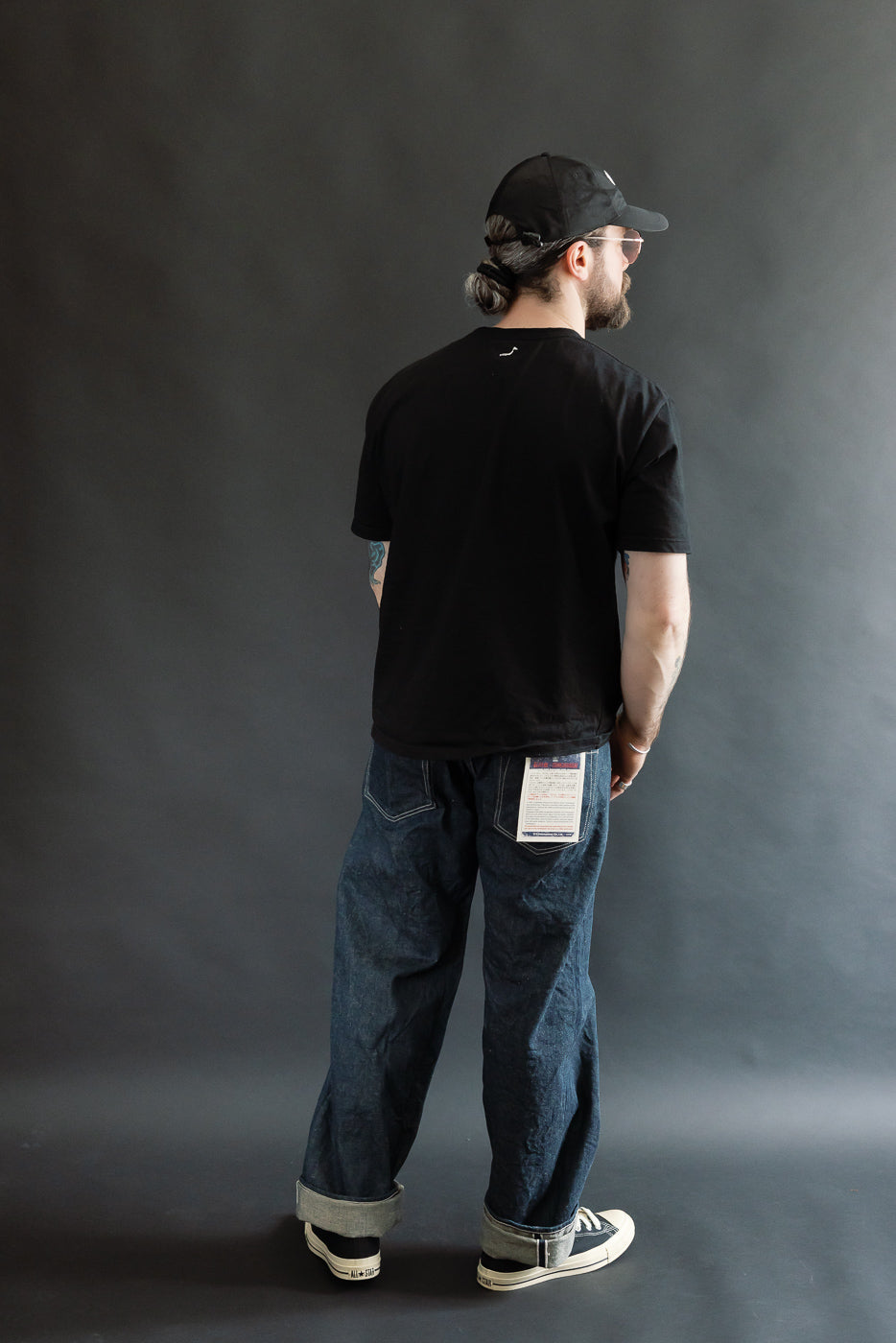 Full body rear view of male model 5'9
