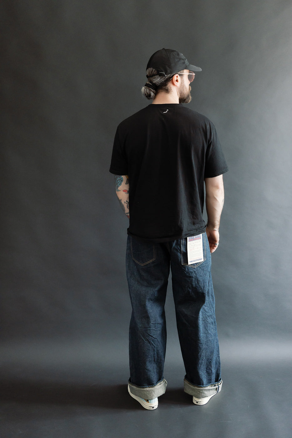 Full body rear view of male model 5'9