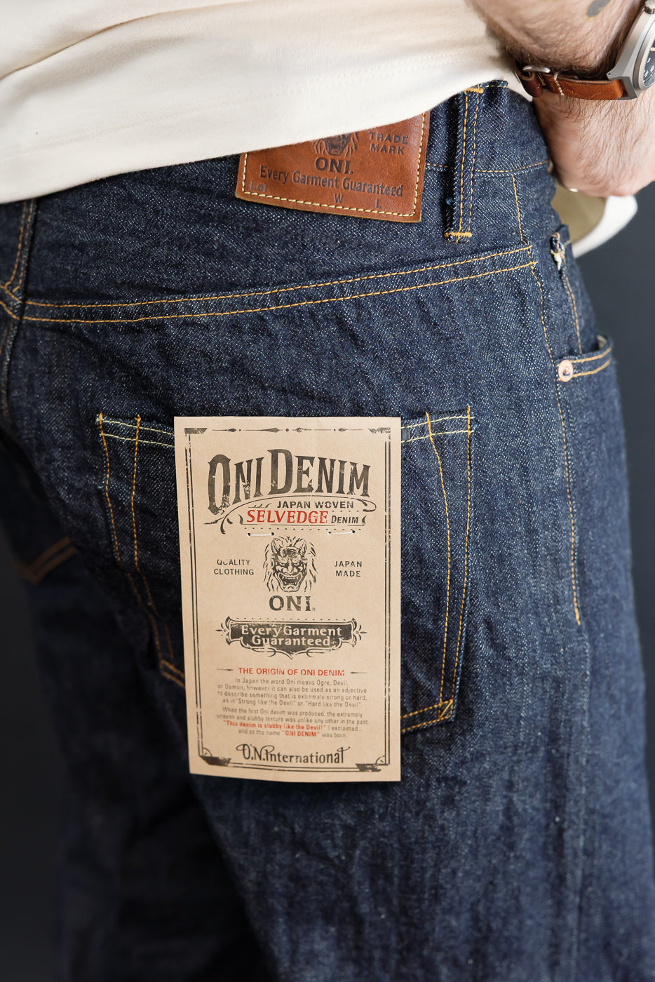 Close-up, back view of dark indigo Oni Denim on a male model (5'9