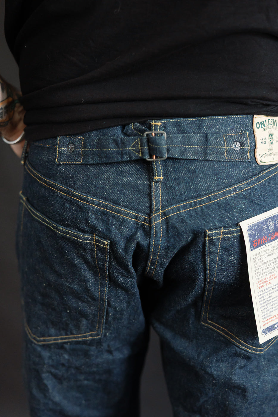 Close-up of back of selvedge denim jeans on male model, 5'9
