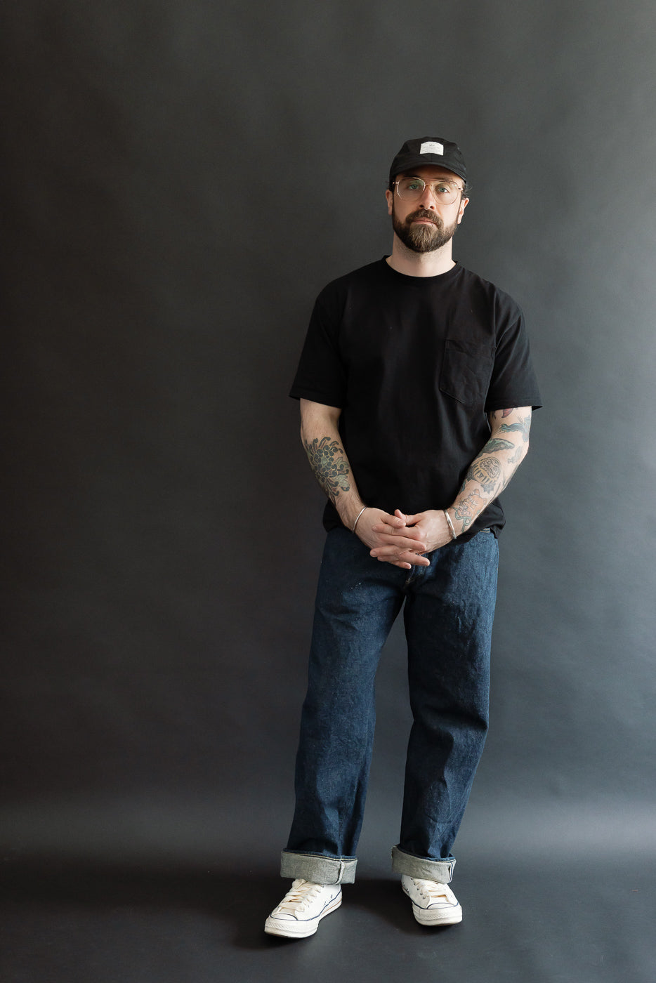Full body front view of a male model, 5'9