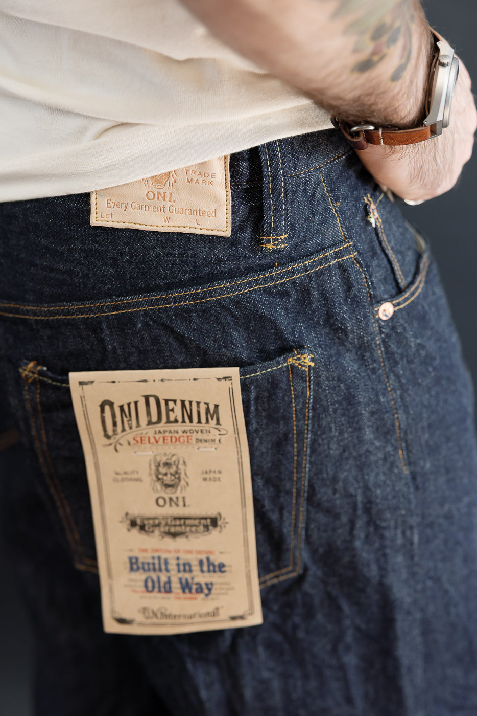 Close-up back view of Oni Denim on a male model, 5'9