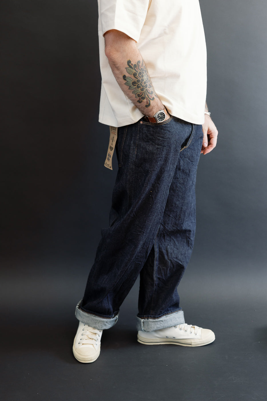 Full body side view of a male model, 5'9