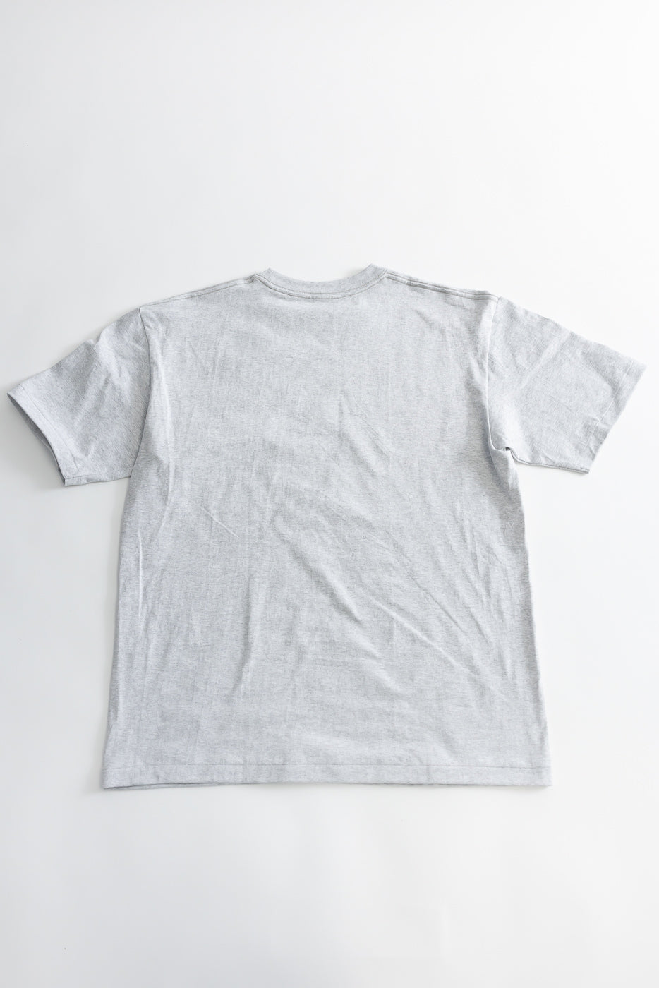 Flat lay of heather grey t-shirt, back view, showing crew neck, short sleeves, and hem details.