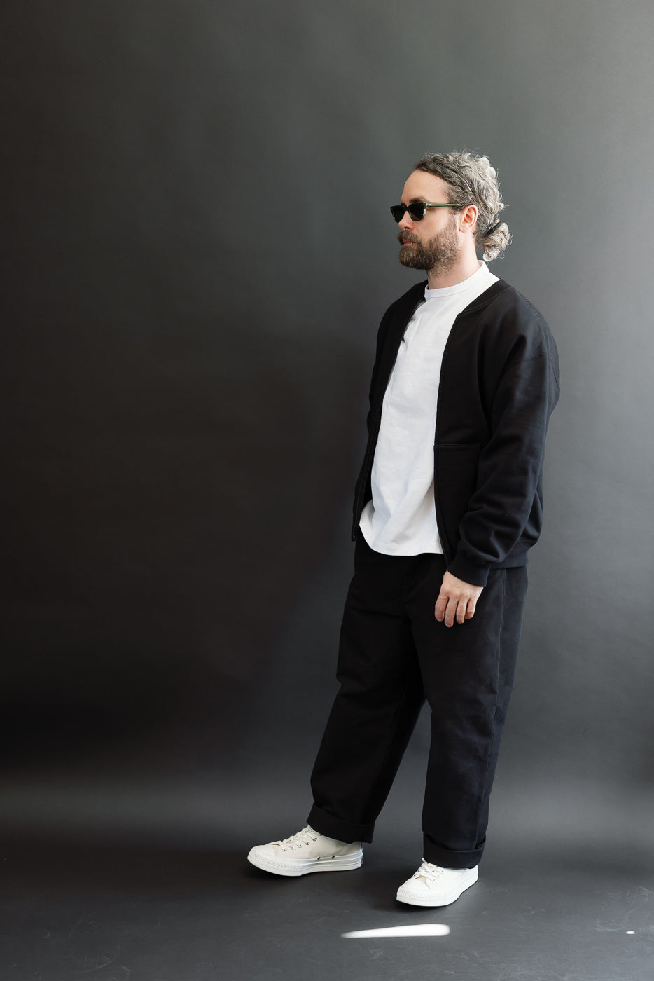 Full body side view of a male model, 5'9
