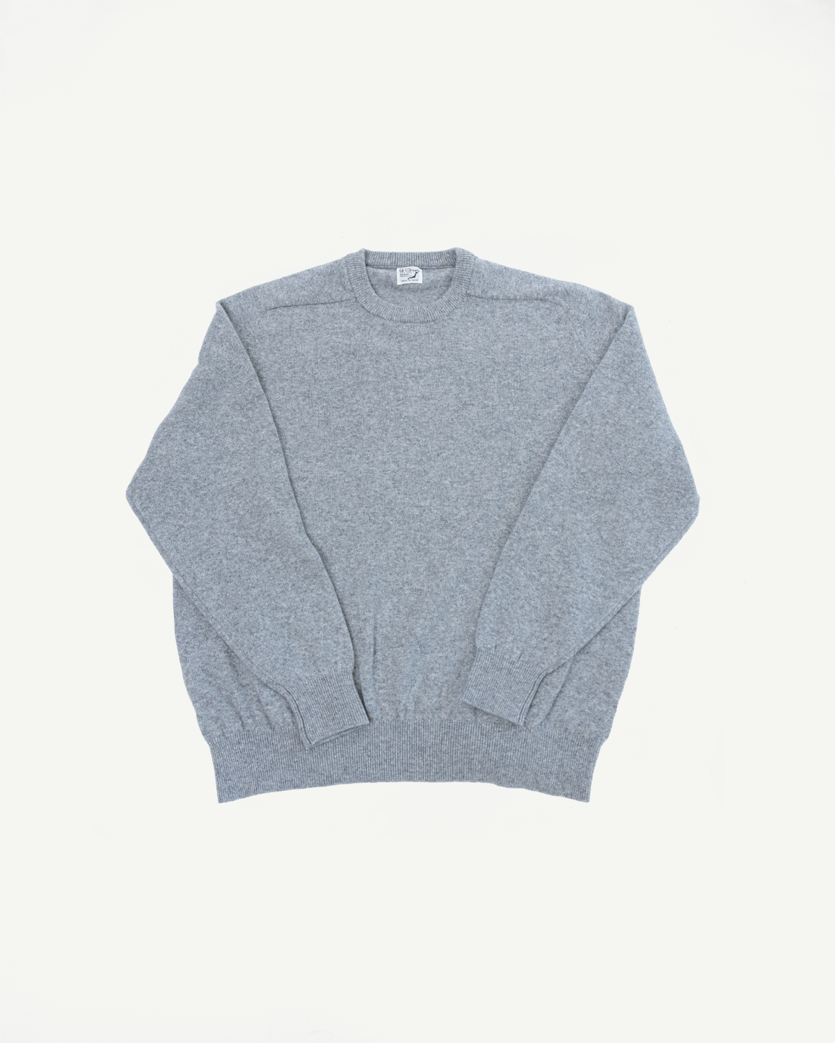 Front view flat lay of a grey crewneck knit sweater showing the full garment.