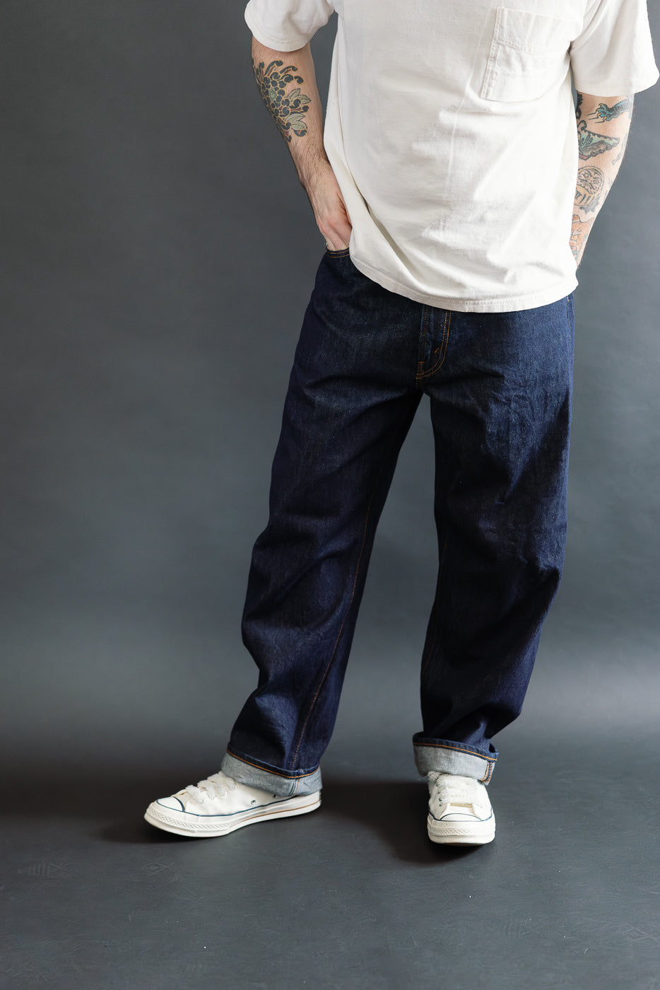 Front view, mid-rise dad fit denim jeans on male model 5'9