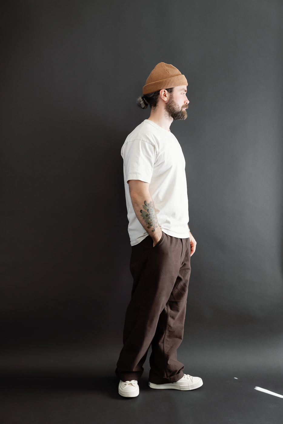 Full body side view of a male model, 5'9
