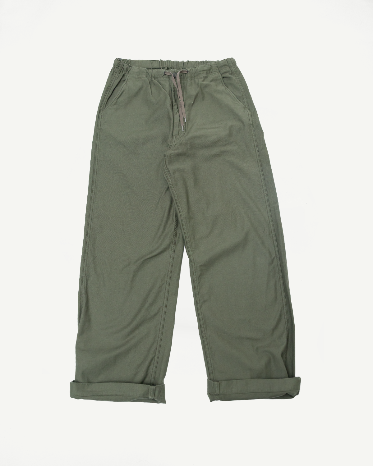 Flat lay front view of orSlow New Yorker Pants wide fit in dark olive, elastic waist, cuffed hem