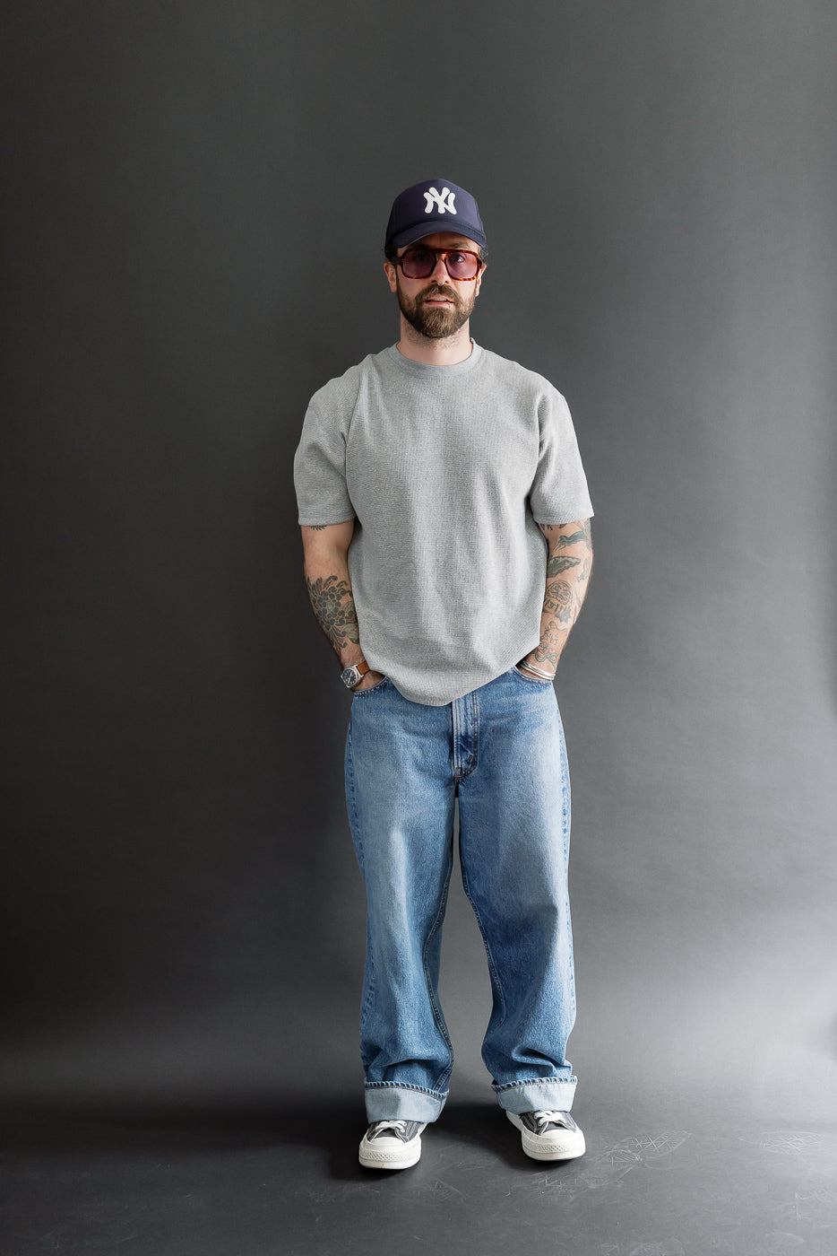 Full body front view of a male model, 5'9