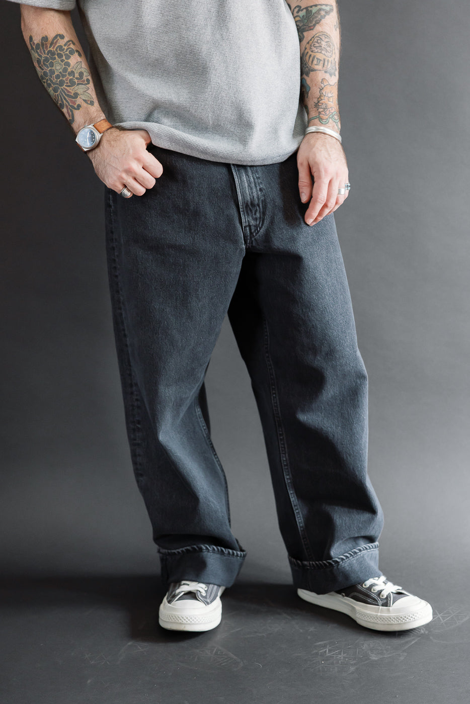 Front view of charcoal denim jeans on a male model, 5'9