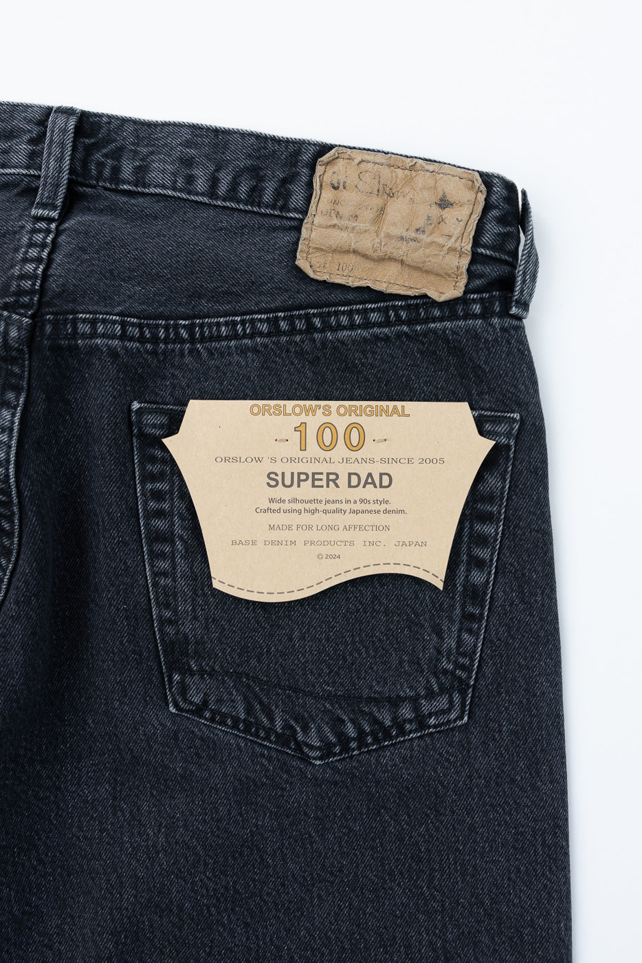 Back view close-up of Orslow 100 Super Dad jeans, showing back pocket tag and Japanese denim texture.