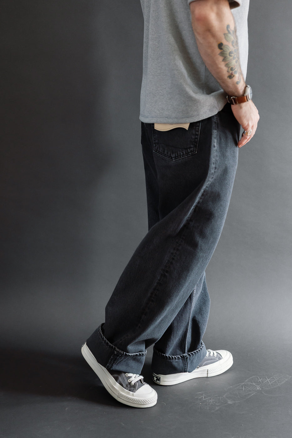Full body side view of a male model, 5'9