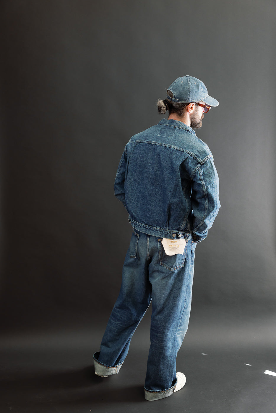 Full body back view of a male model, 5'9
