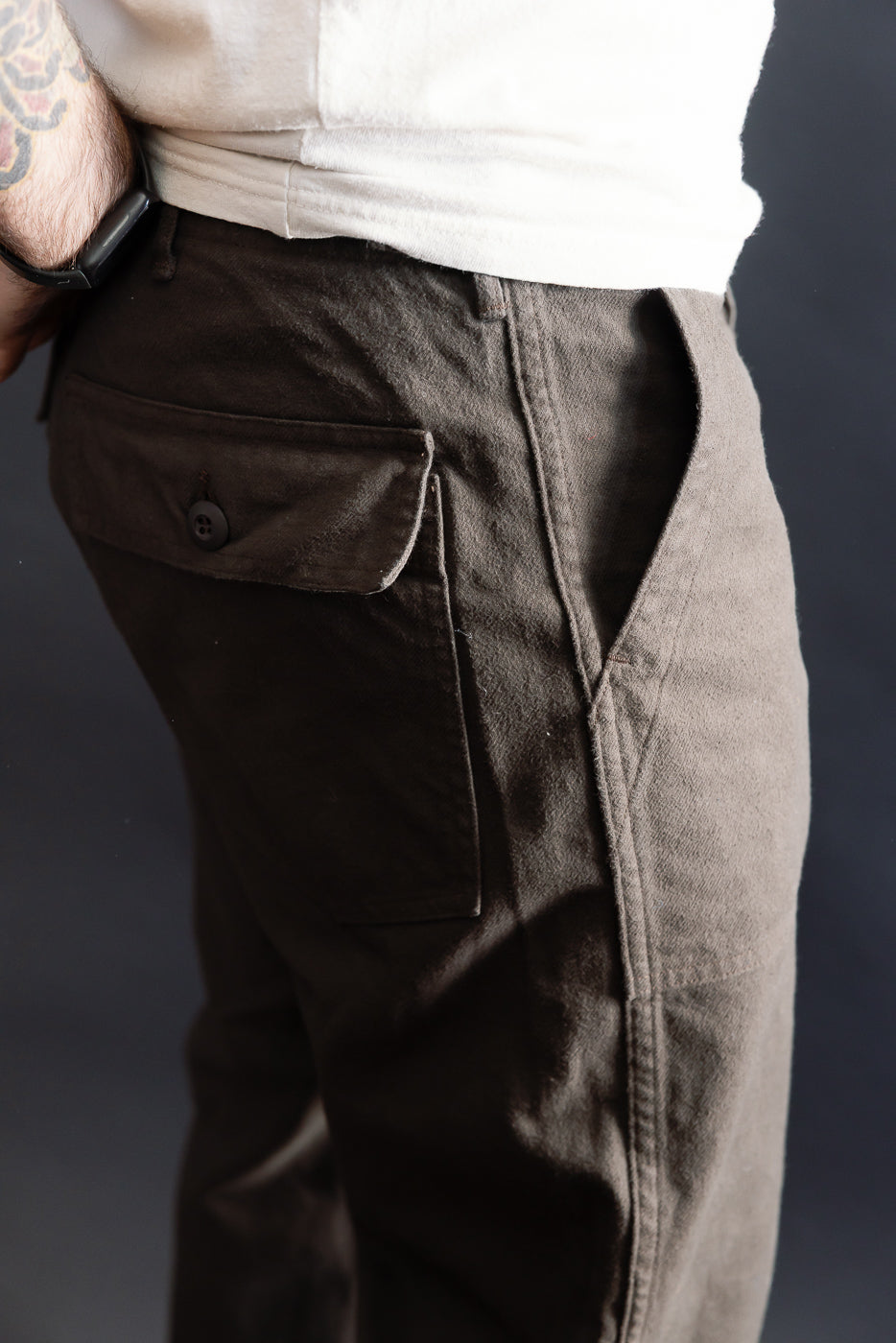 Close-up right side view of orSlow coffee brown brushed flannel fatigue pants on male model, 5'9