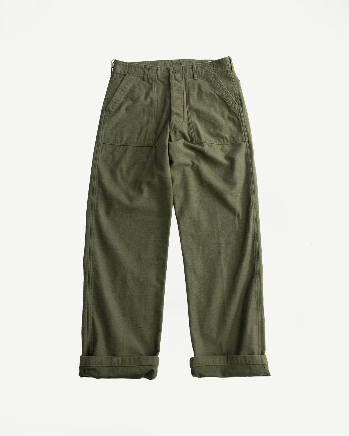 Flat lay of army green ripstop fatigue pants, front view showing pockets, waistband, and cuffed hems.