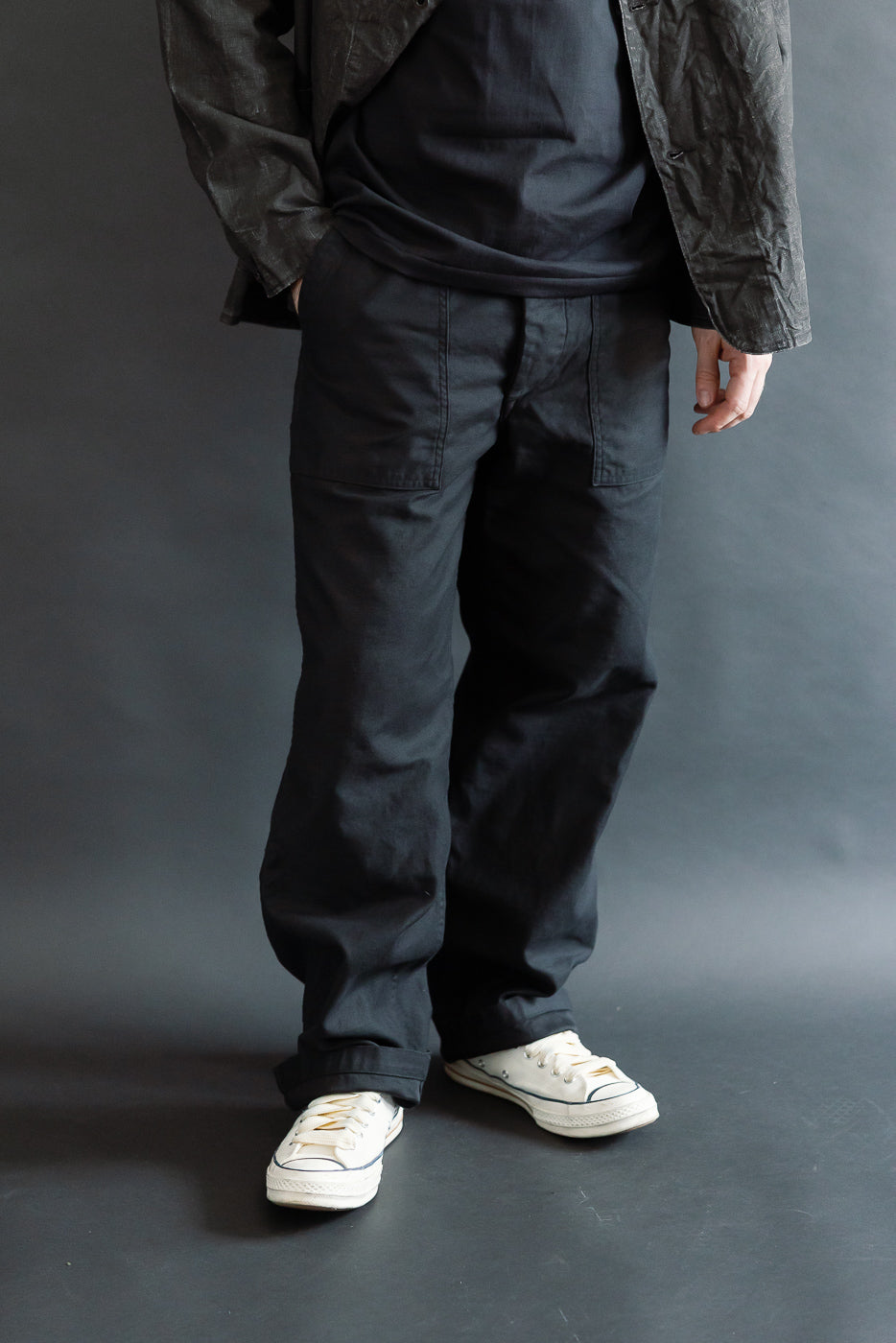 Front view, cropped full body of male model 5'9