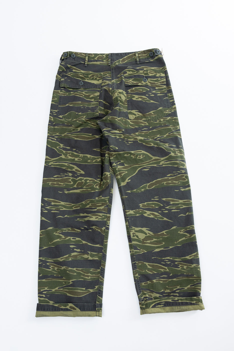 01-5002-TGC - Fatigue Pants Ripstop Standard Fit - Tiger Camo laid flat, showcasing straight-leg cut, tiger stripe camouflage, patch pockets with buttoned flaps, side-adjuster tabs, and belt loops, made from durable ripstop cotton.