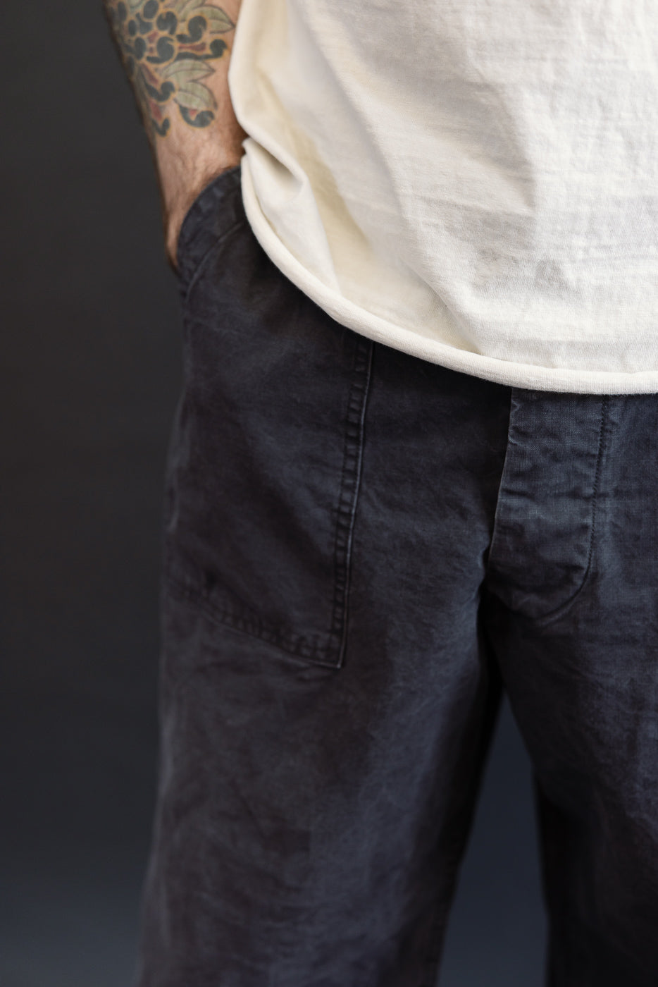 01-5103-M61K - Duck Canvas Summer Fatigue Pants - Black, featuring a high rise and roomy fit, with visible patch pockets and adjustable waist, capturing a relaxed, worn-in summer style.