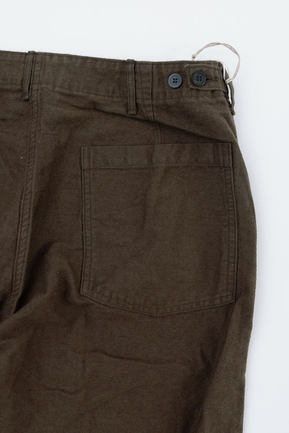 Close-up of orSlow coffee brown fatigue pants, back left side pocket and waistband buttons, cotton linen moleskin, Dant