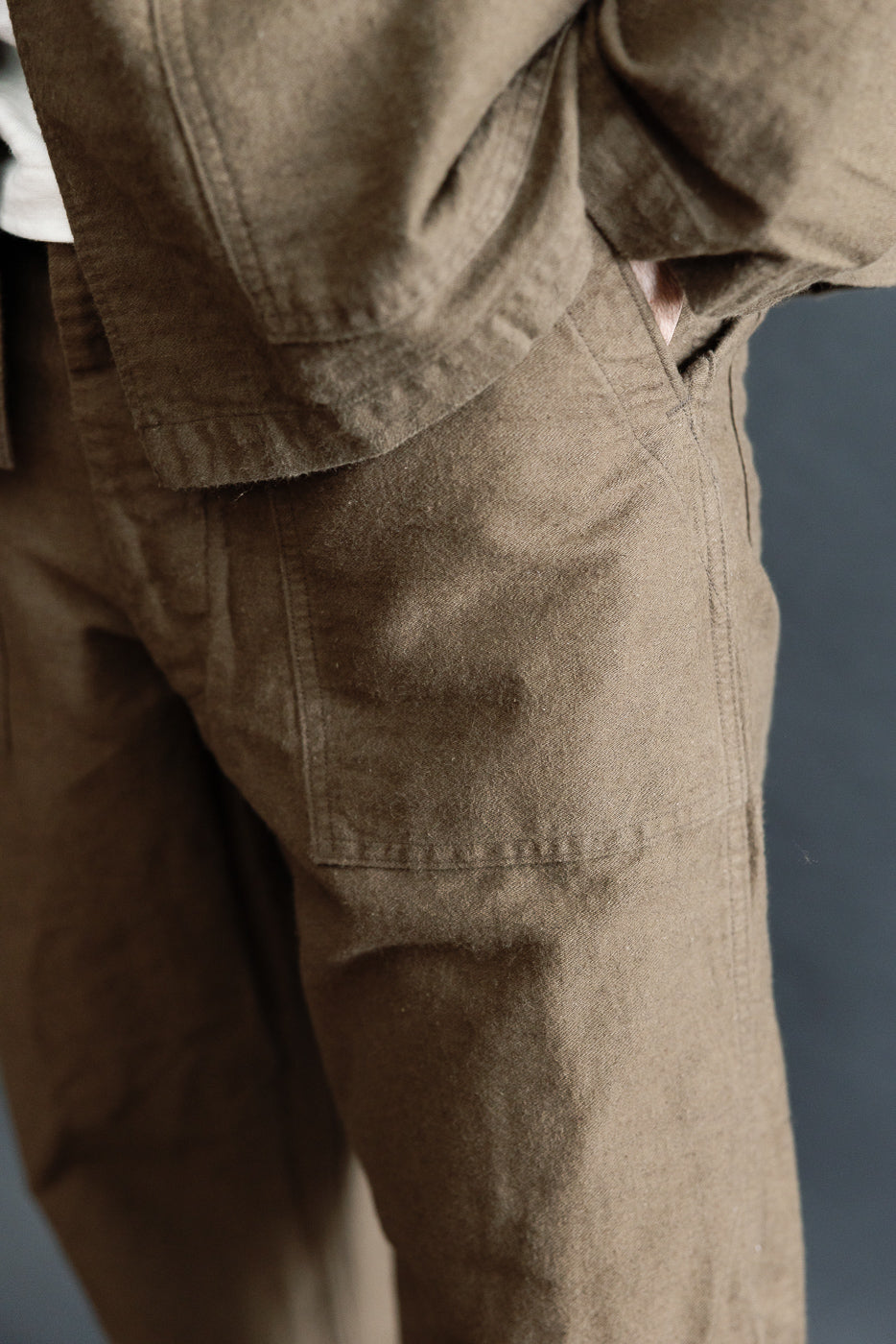 Close-up front view of Orslow coffee brown fatigue pants cotton linen moleskin on male model 5'9