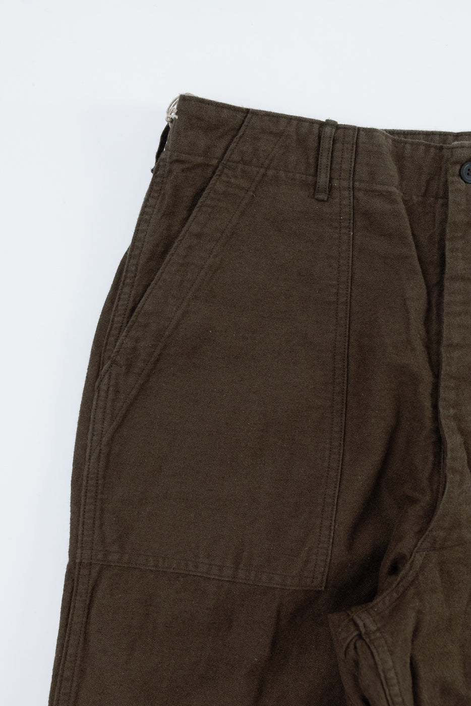 Close-up front view of Orslow coffee brown cotton linen moleskin fatigue pants, highlighting pocket and fabric texture, Dant contemporary casual apparel.