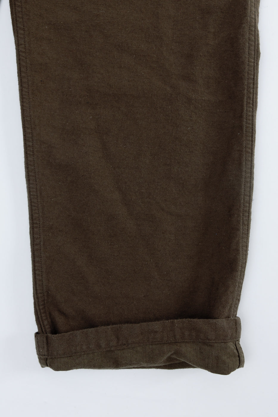 Close-up front view of coffee brown Orslow fatigue pants leg, cotton linen moleskin, cuffed hem