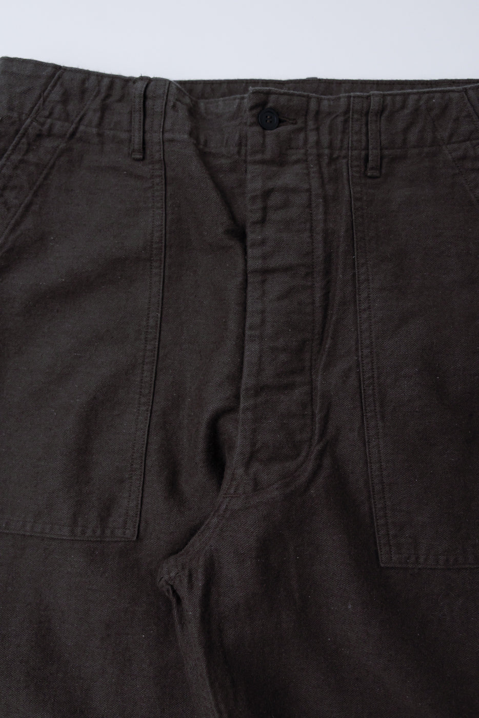 Close-up of front waist and pocket details on orSlow charcoal gray cotton-linen moleskin fatigue pants
